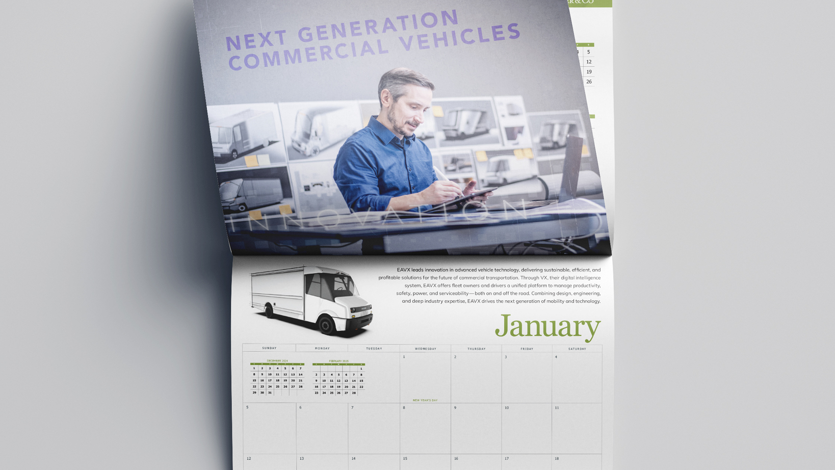 A two-page calendar with a man in a blue shirt using a tablet and a truck image, showing 'January' text and a calendar layout below.