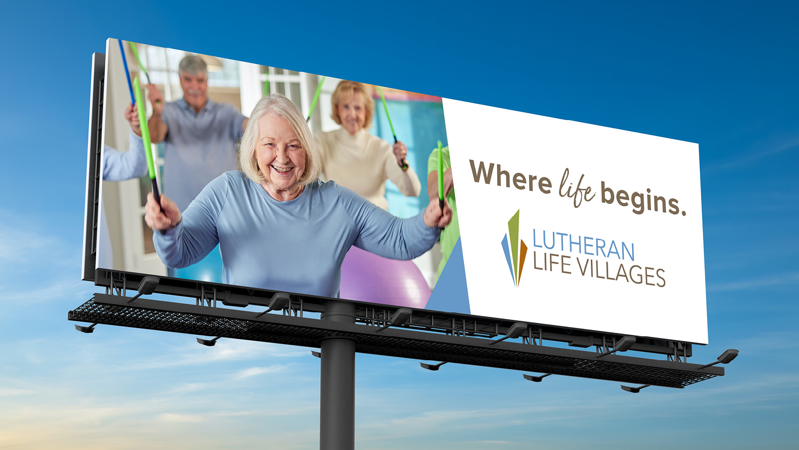 Billboard featuring smiling seniors exercising with resistance bands; text reads 'Where life begins' and 'Lutheran Life Villages'.